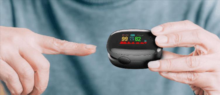 A person holding a device to check their pulse

AI-generated content may be incorrect.